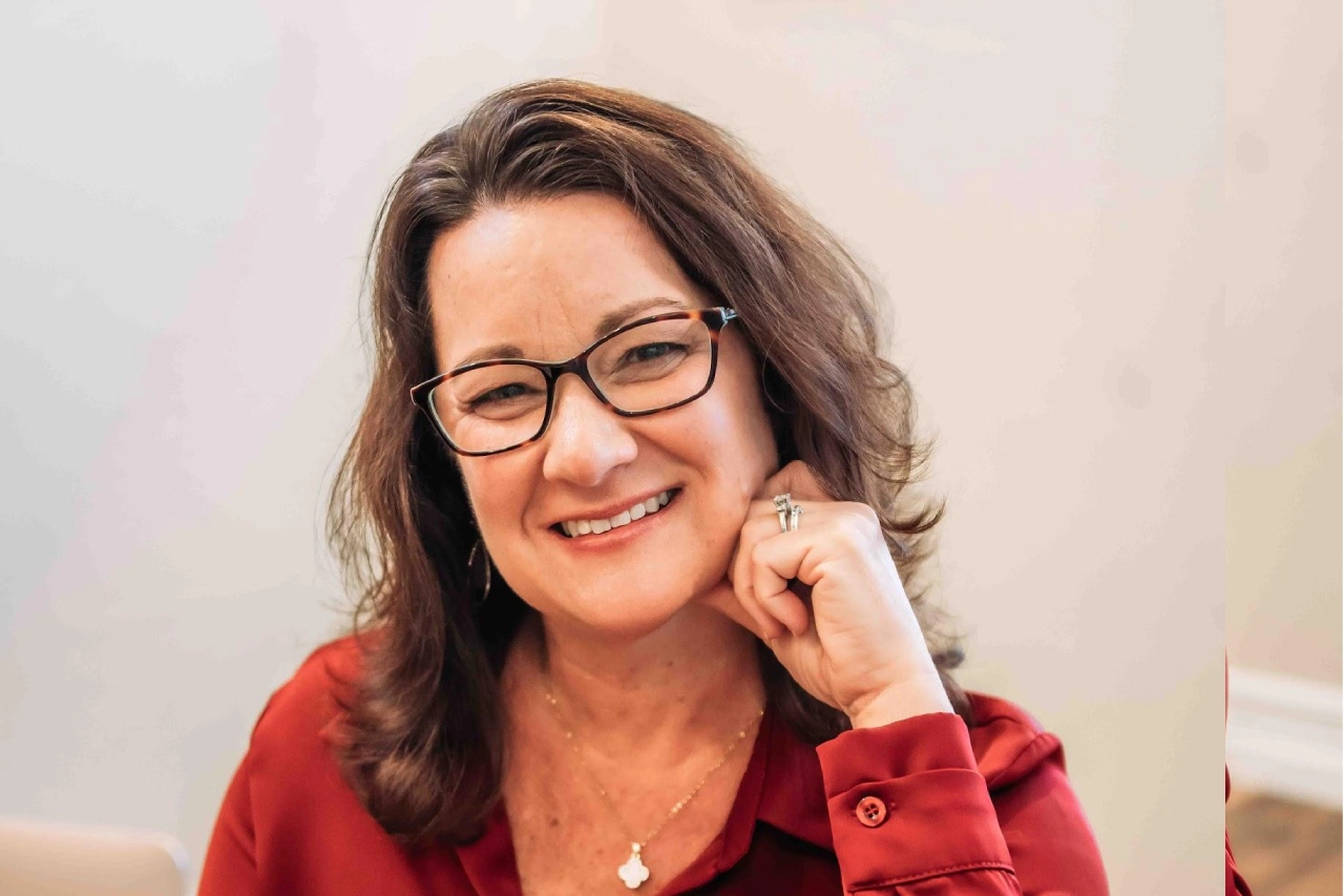 Katie Wilde with Glasses in red blouse